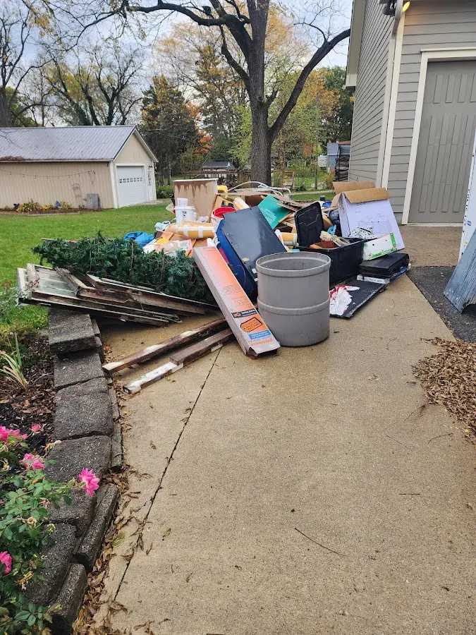 Dumpster being loaded with debris for Residential Dumpster Rental in Dothan